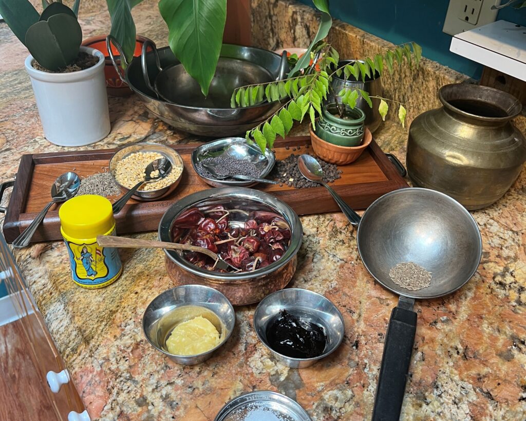 a counter top with spices and seeds in small bowls