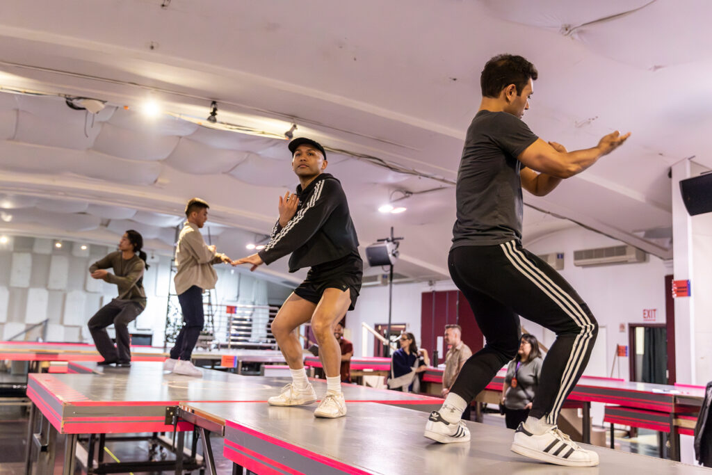 dancers rehearsing on top of tables