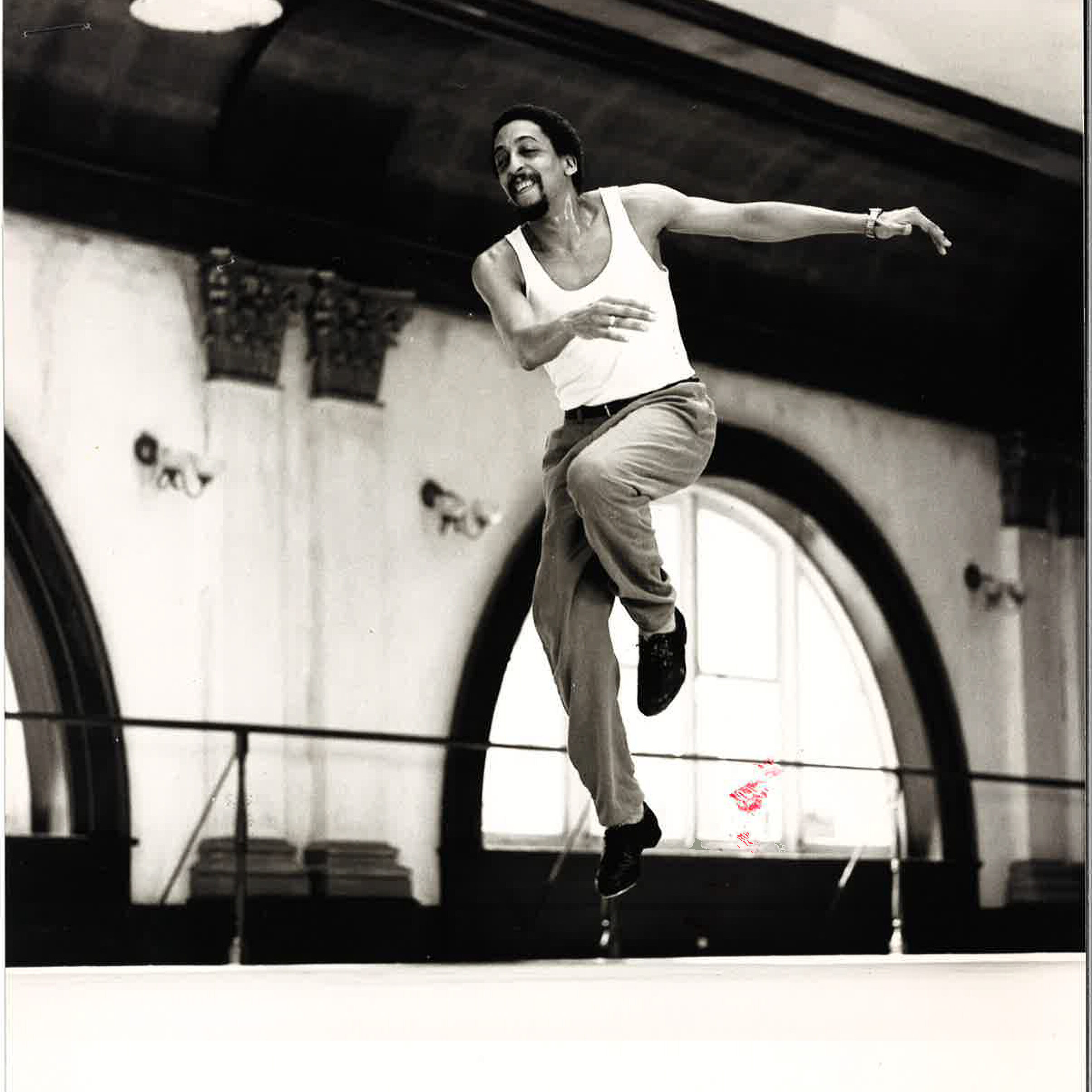 a man tap dancing in a studio