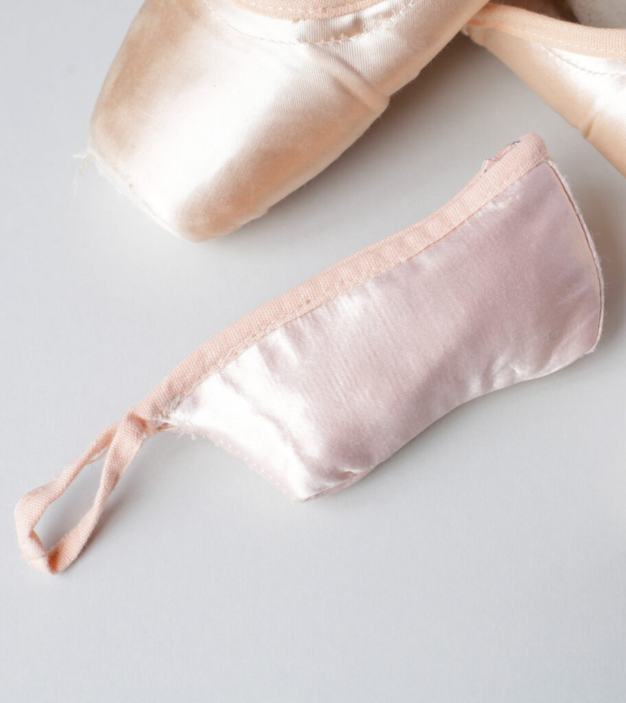 a satin pouch made out of pointe shoe material